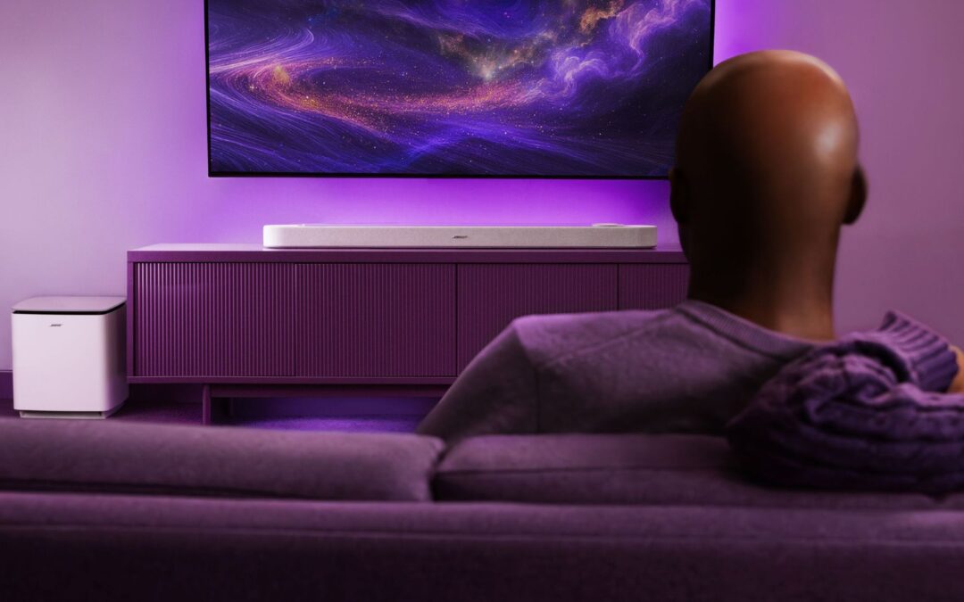 African american reviewing the white Bose Lifestyle Ultra Subwoofer.